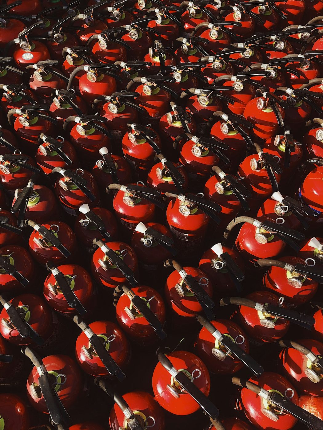 Rows of fire extinguishers serviced and ready for deployment